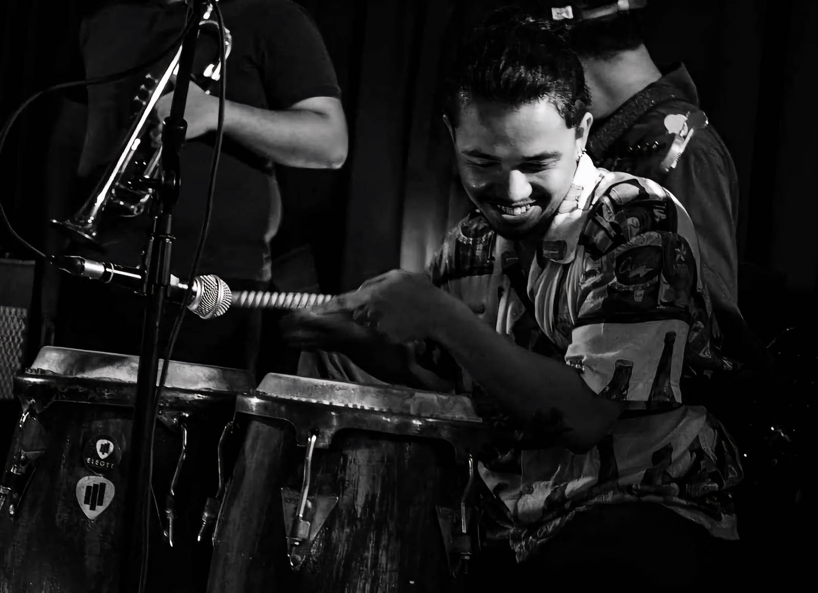 Percussionist playing in Tago
