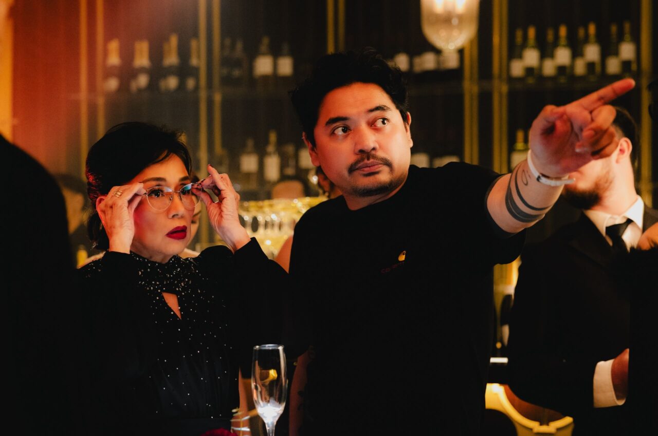 director dan villegas and actor vilma santos on the set of uninvited