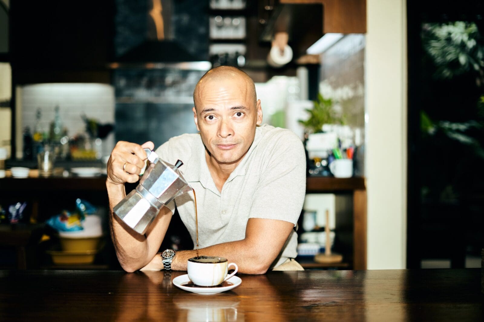 tv personality paolo abrera pouring coffee into a cup from a moka pot