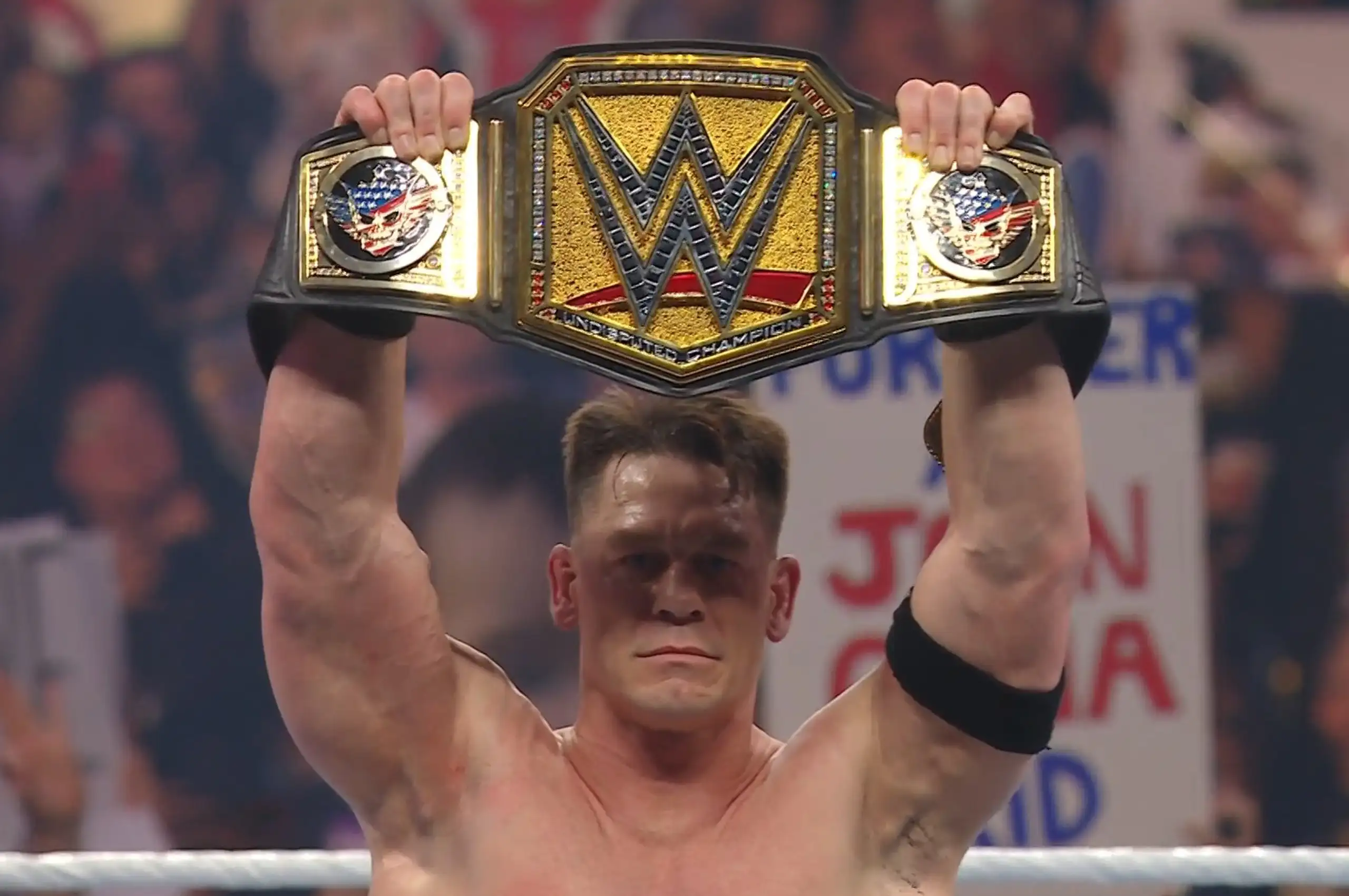 john cena holding a championship belt