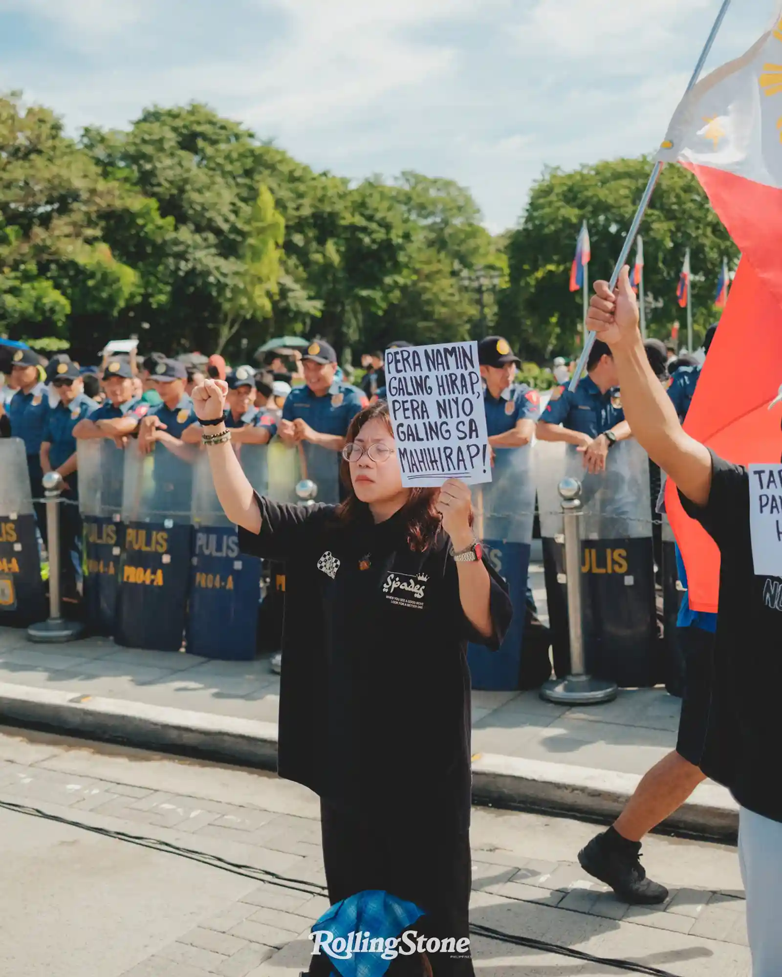 protester in front of police