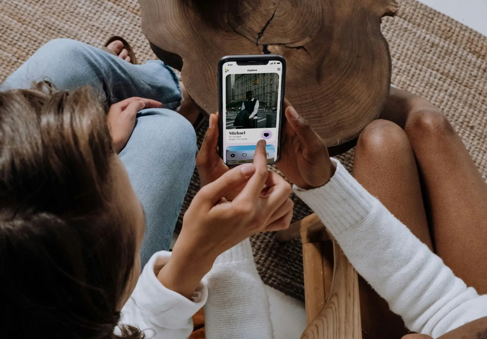 women looking at tinder profile