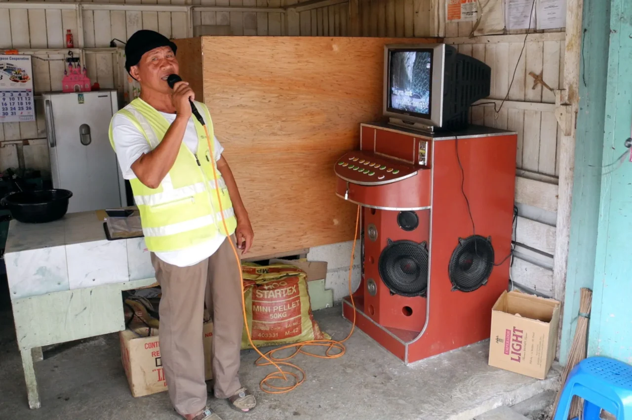man and videoke machine