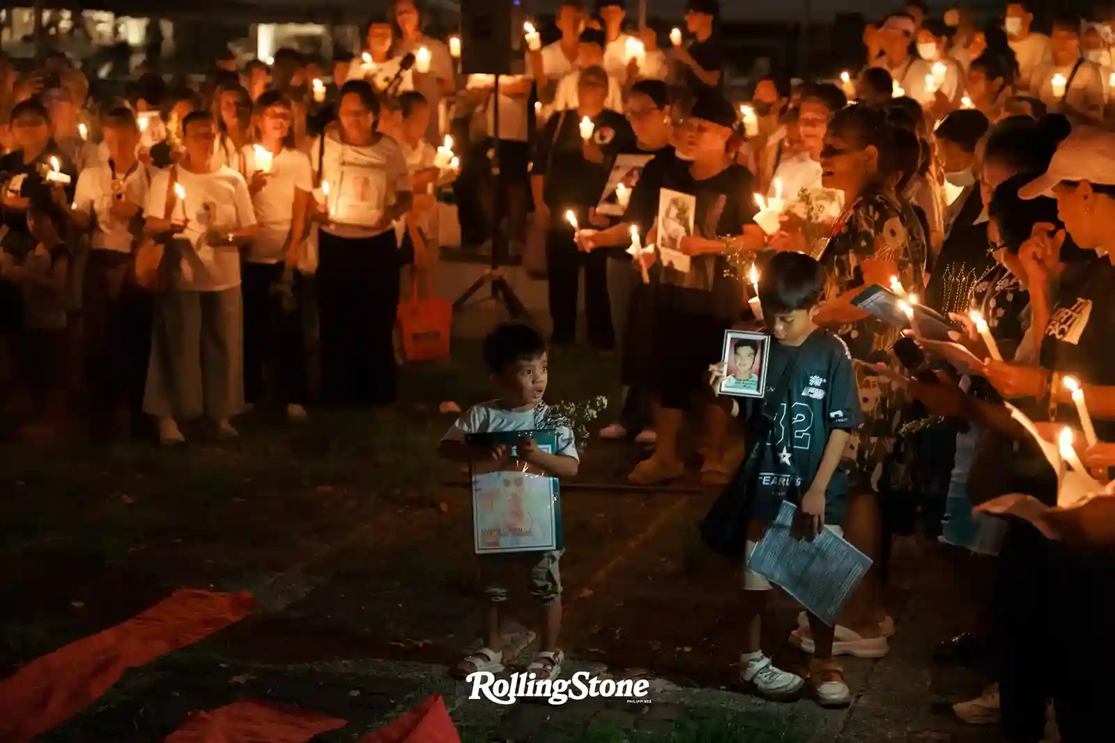 children at a candle light cremony for victims of the philippine drug war in bantayong ng mga bayani quezon city