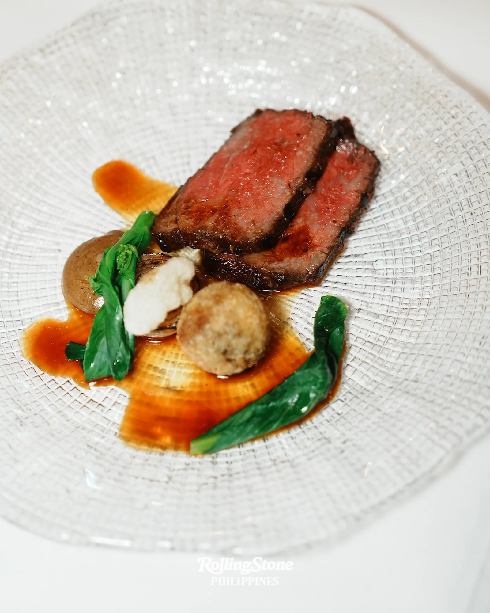 Tajima Wagyu served with oxtail croquette and burnt onion. Photo by Kieran Punay